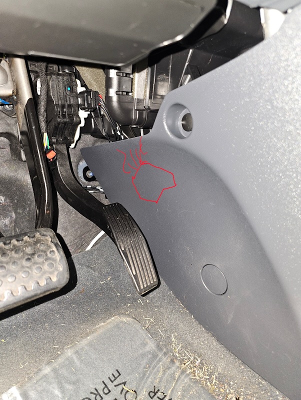 Image of where the pedal can be tucked behind the plastic